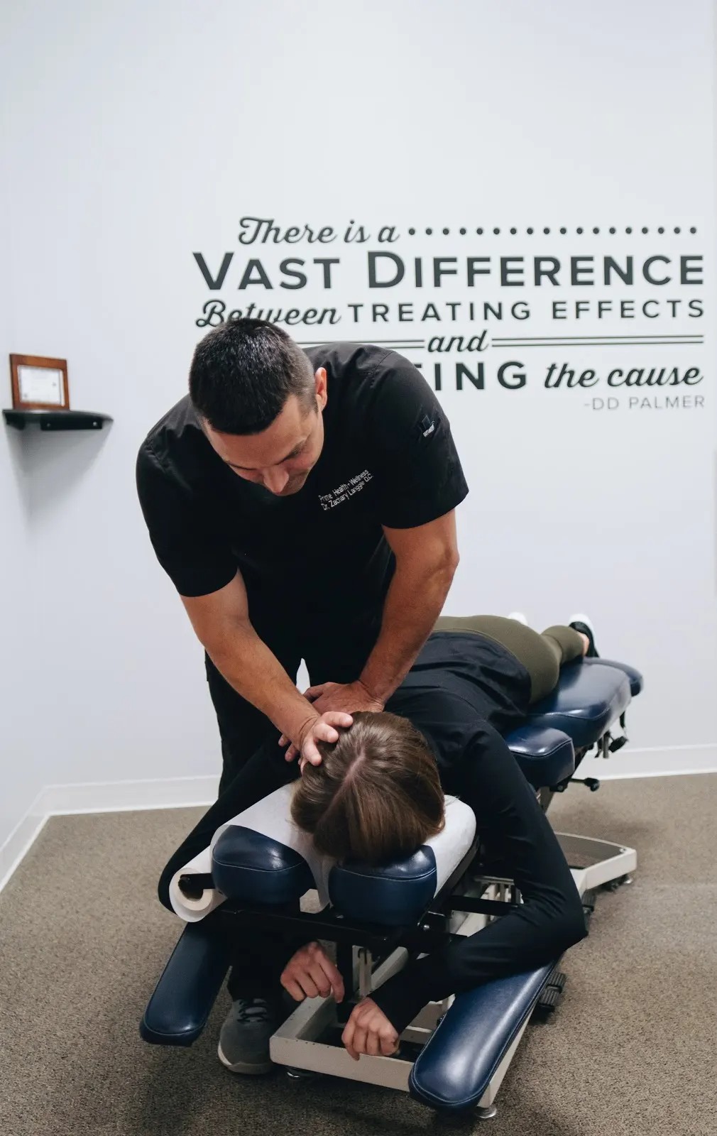 Dr. Zachary Langgle providing chiropractic treatment in Downers Grove IL